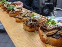 Mushroom and bread appetizer made by Ely's Fine Foods 