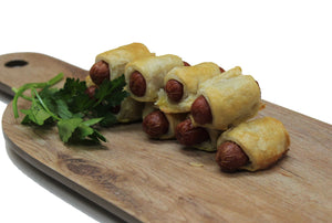 Mini hot dog in a blanket made by Ely's Fine Foods